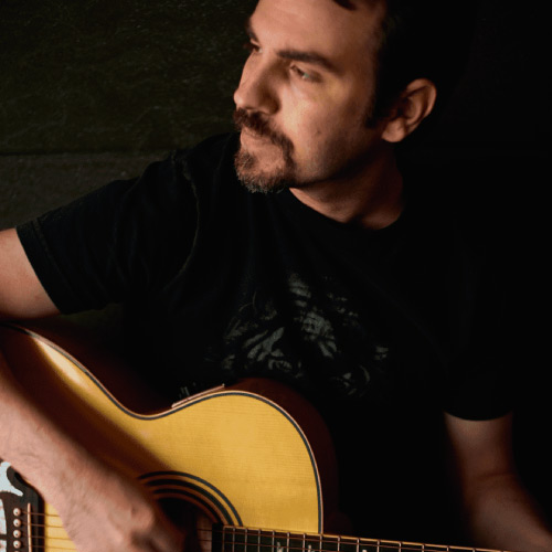 Músico con guitarra